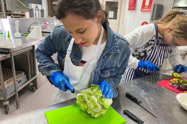 Celeste-cutting-lettuce-learning-life-skills