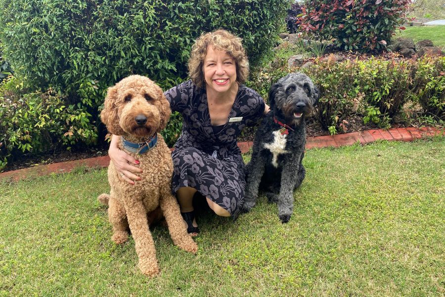 Lisa Hudson with therapy dogs at Greater Heights Therapy Services Toowooomba